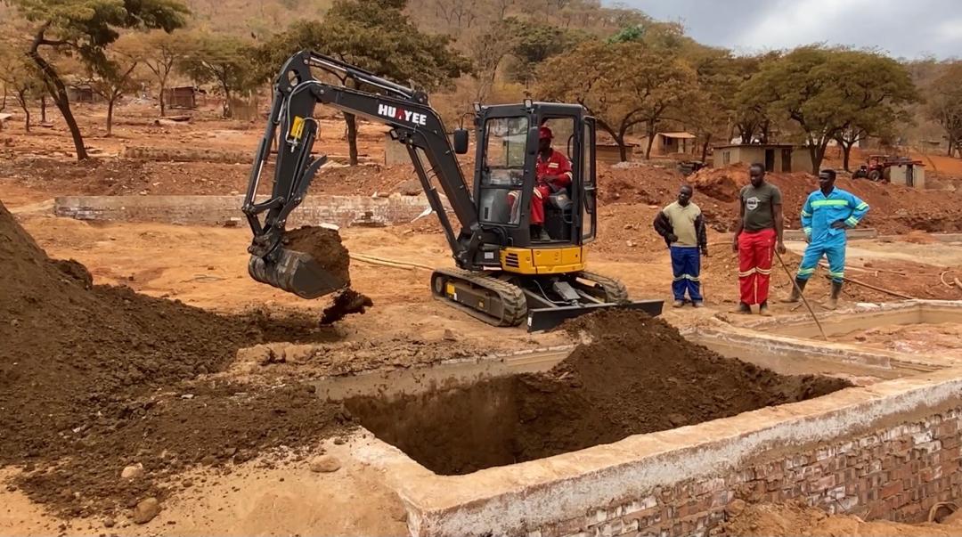 HUAYEE HY35C excavator digging foundations with the site crew