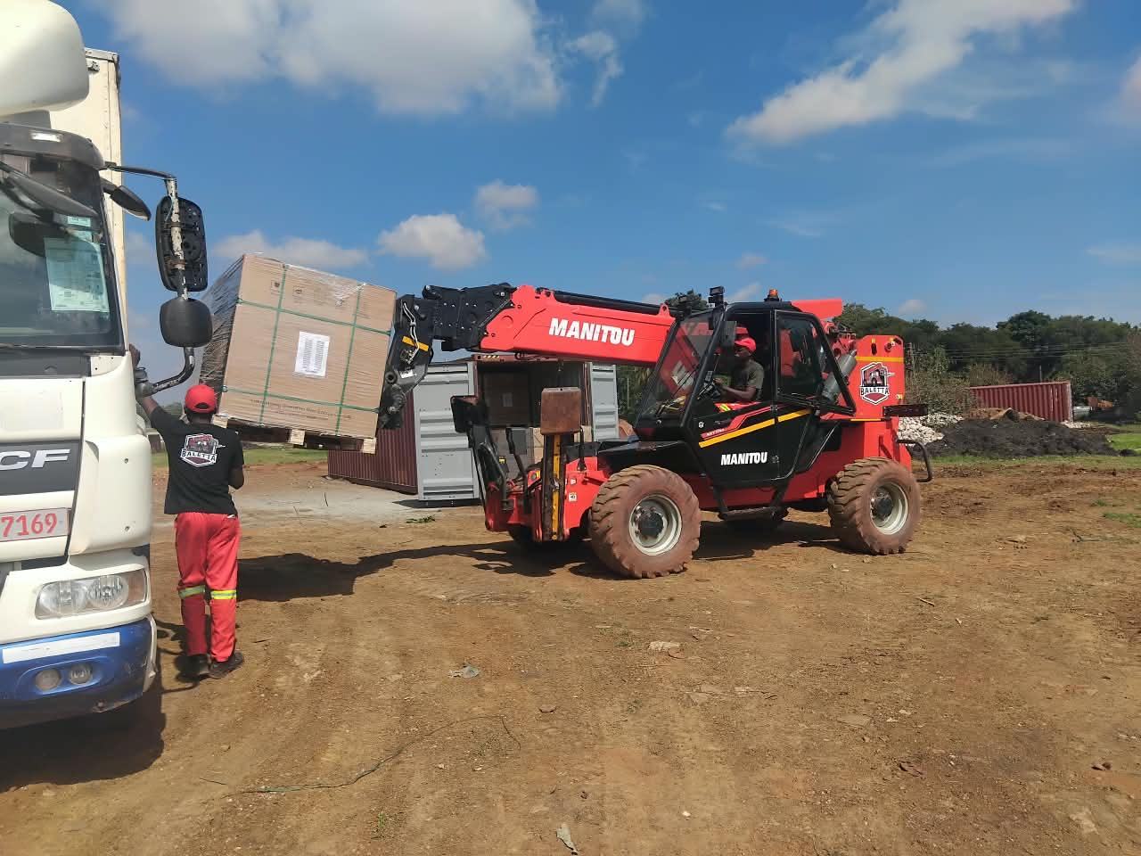 Manitou telehandler unloading a truck