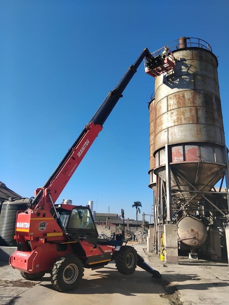 Manitou telehandler with work basket at a silo